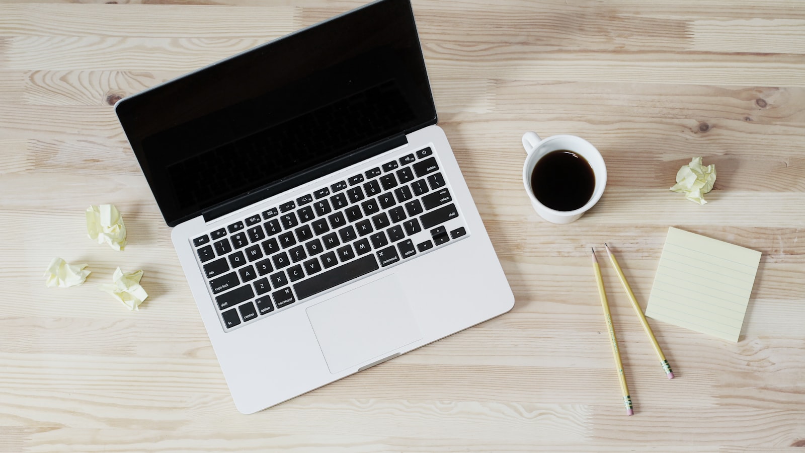 An open laptop on a clean white desk