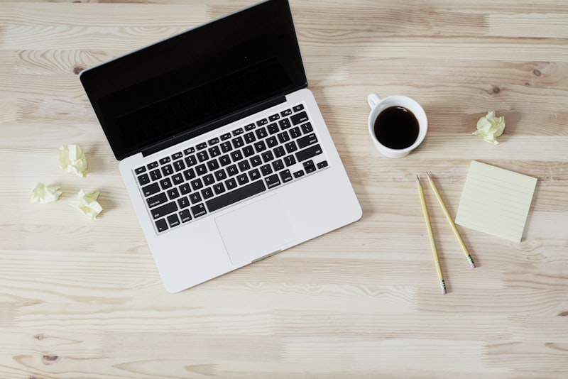 An open laptop on a clean white desk