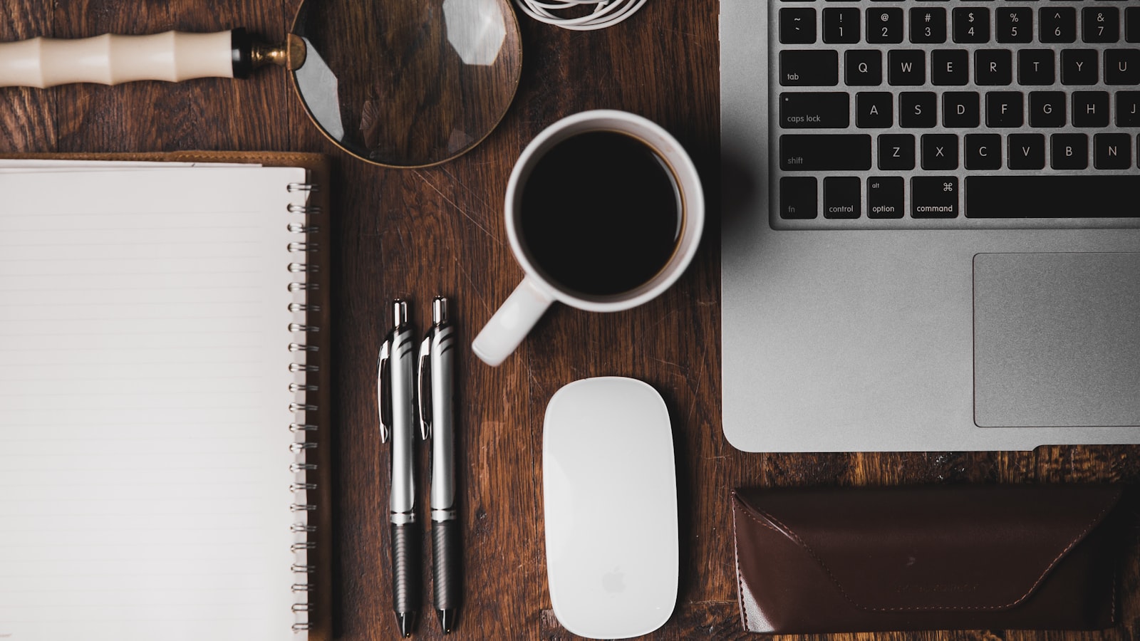 A tidy home-office desk with a laptop