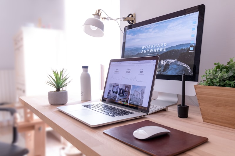 A desk with a dual-monitor computer setup