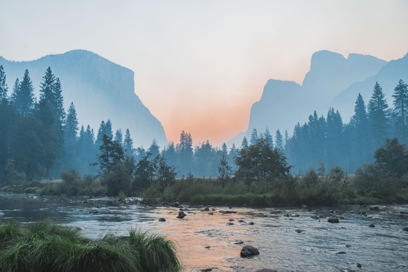 A calm mountain landscape under soft light