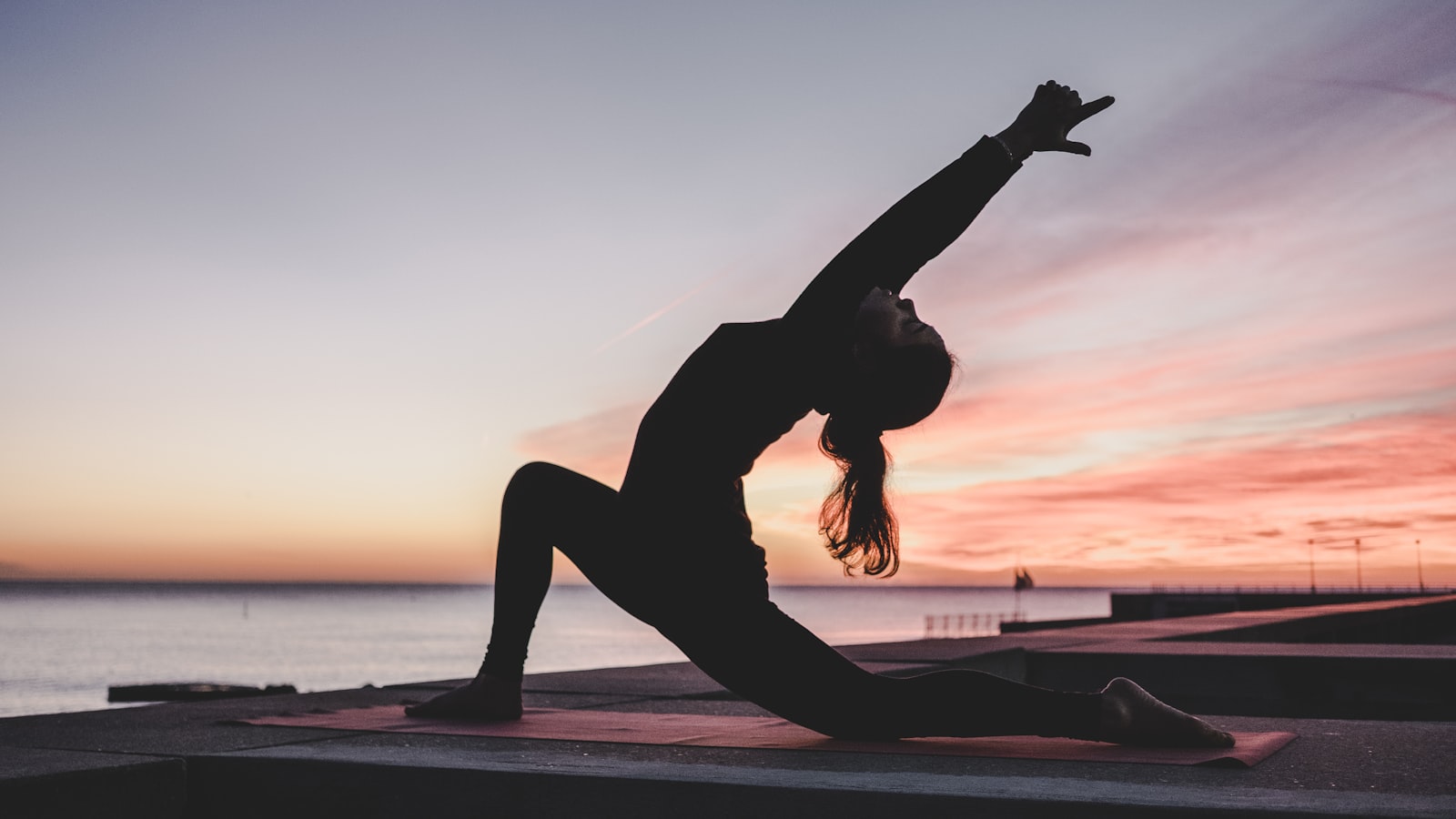 A person stretching during a break from work